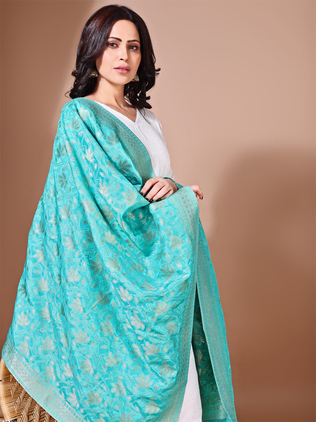 Back view of model wearing sea green bridal Banarasi silk dupatta with intricate zari detailing, ideal for weddings.