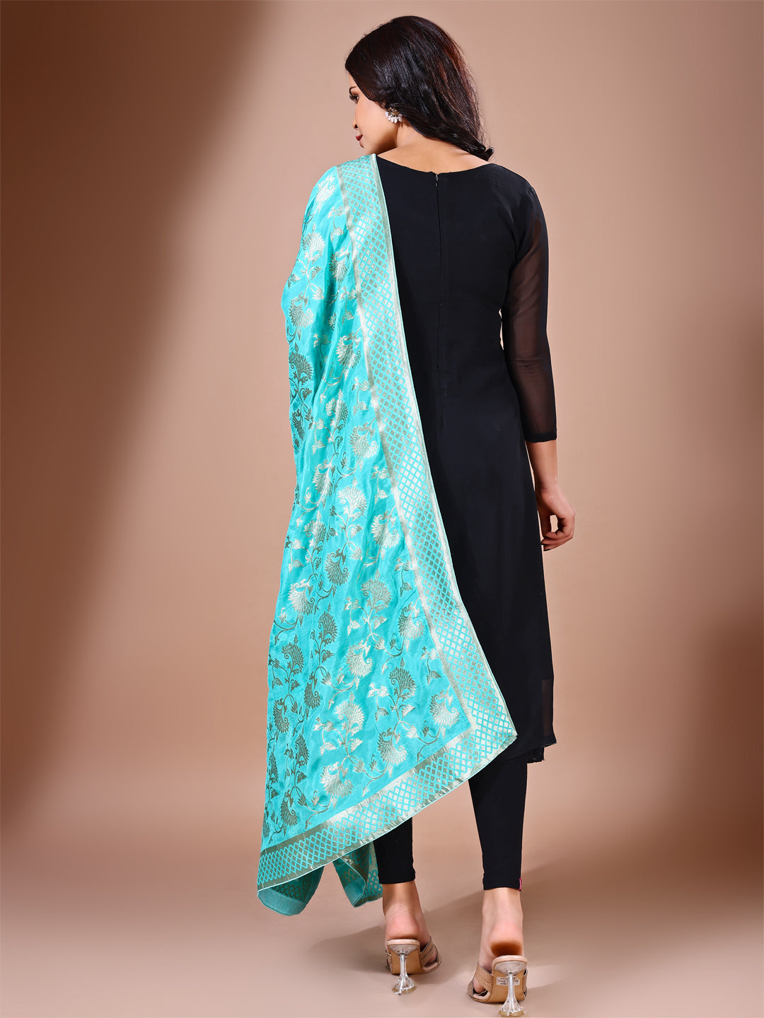 Model in a fancy pose wearing a blue Banarasi bridal dupatta, ideal for wedding wear.