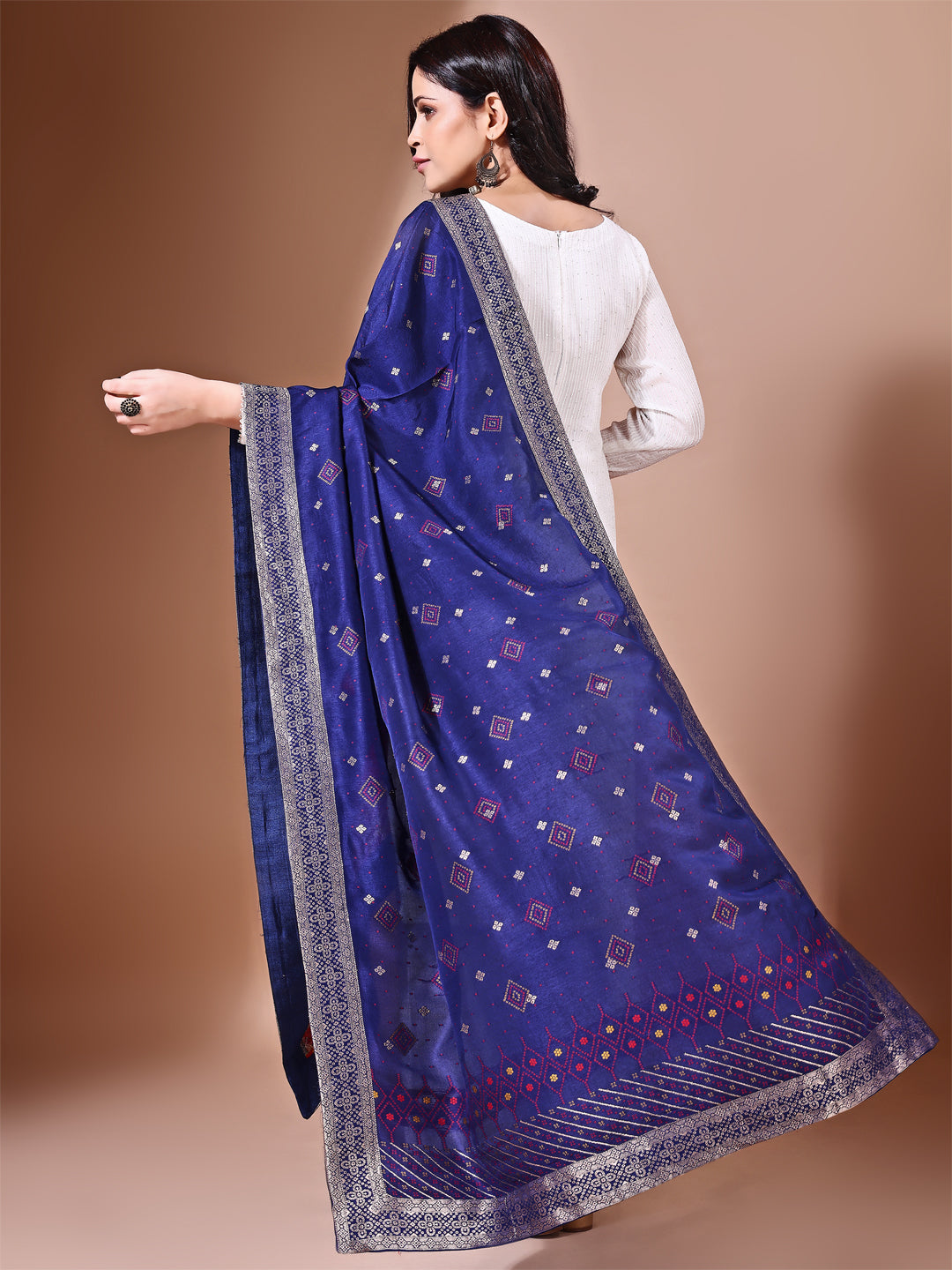 Model in a fancy pose wearing a blue Banarasi bridal dupatta, ideal for wedding wear.