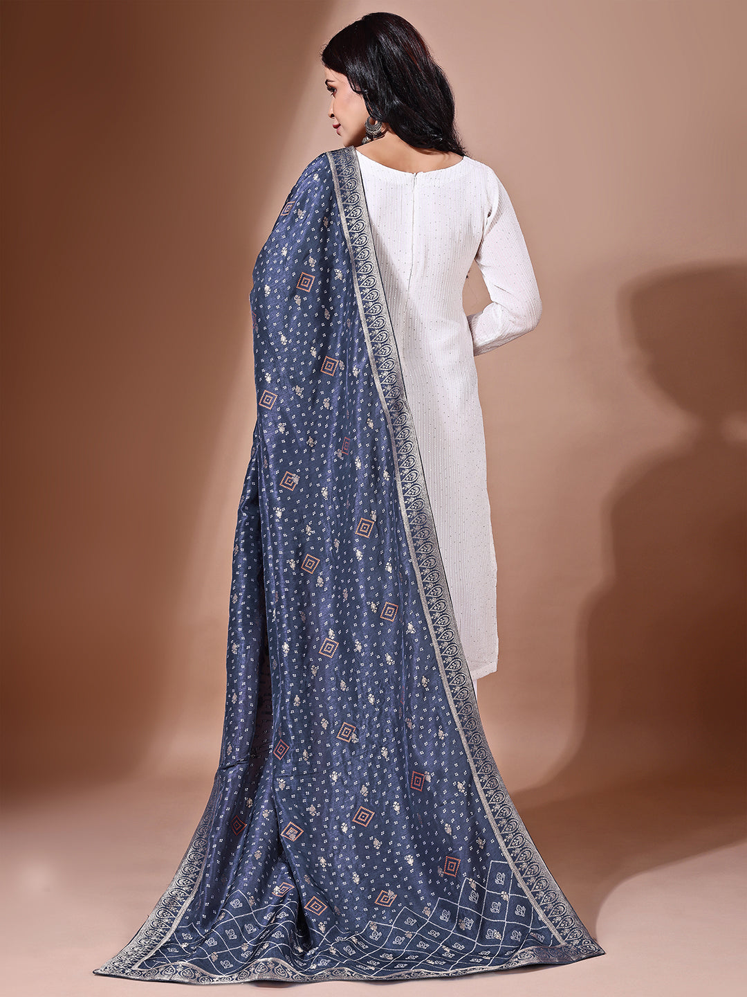 Model in a fancy pose wearing a blue Banarasi bridal dupatta, ideal for wedding wear.