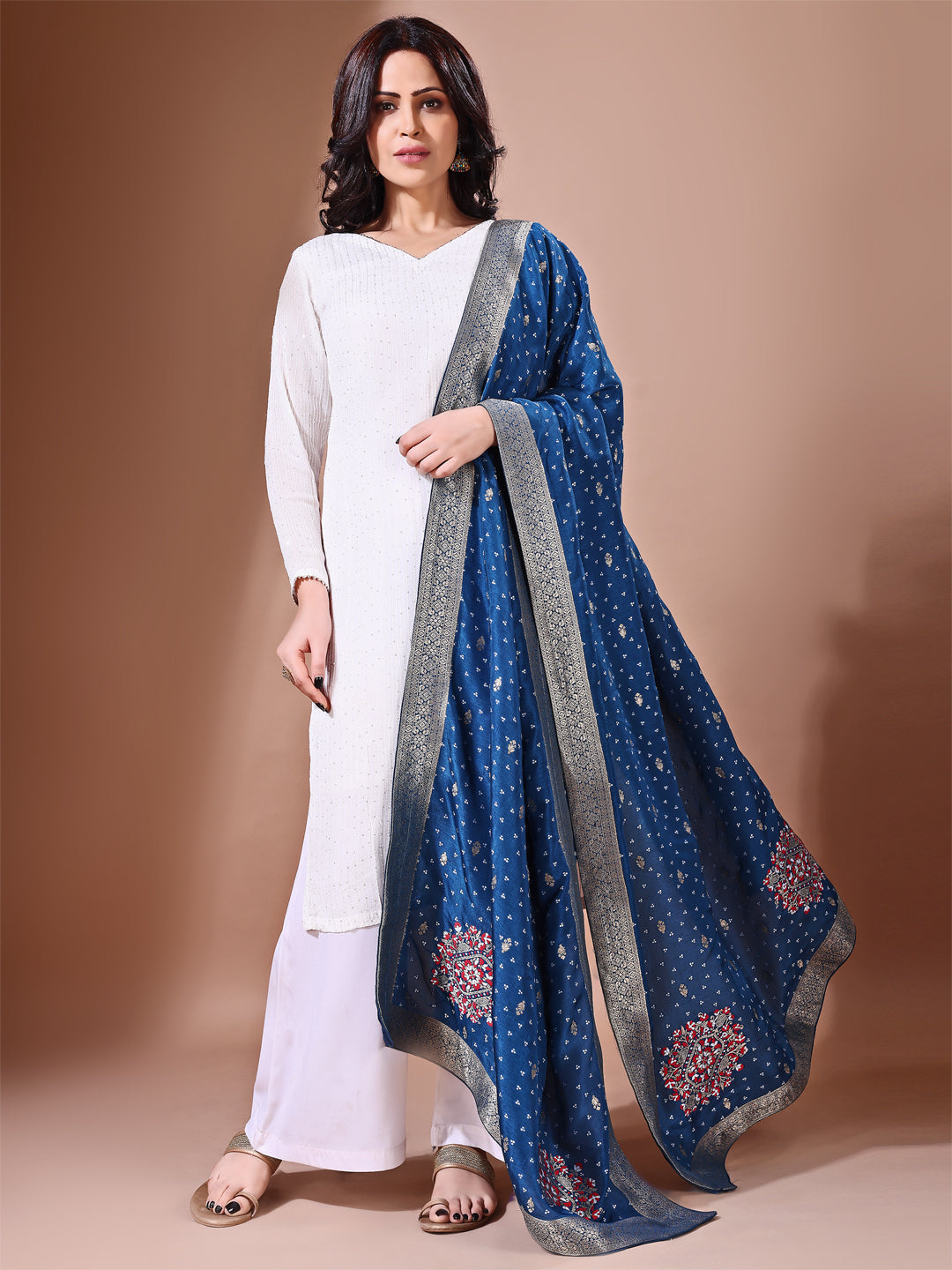 Side pose showcasing the blue bridal dupatta, designed for weddings and special occasions.