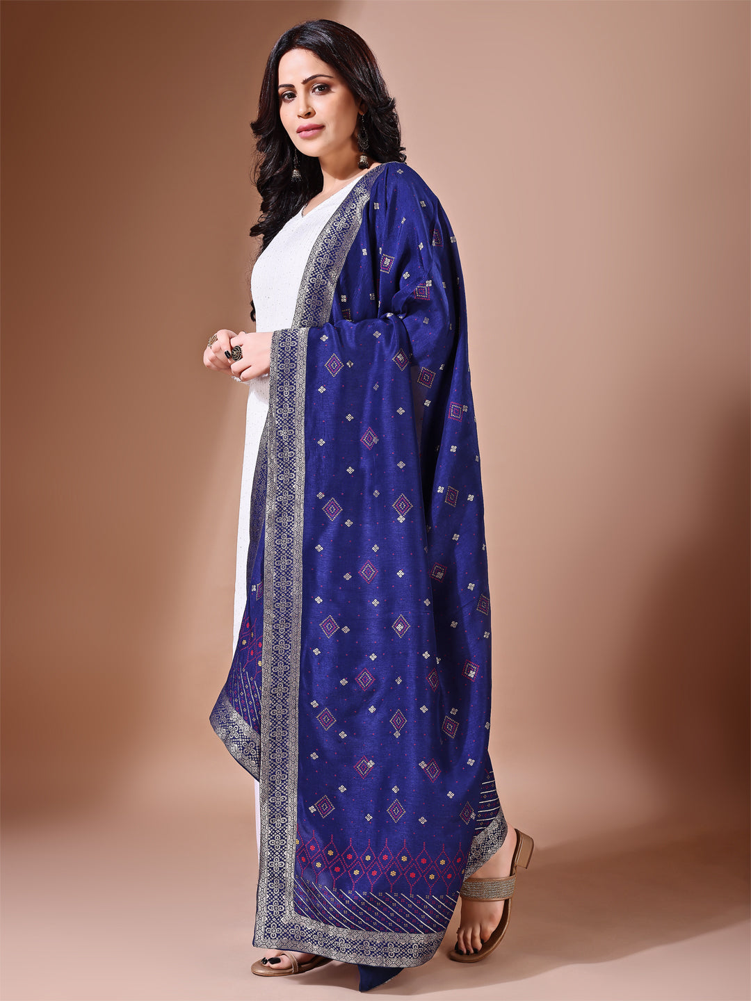 Side pose showcasing the blue bridal dupatta, designed for weddings and special occasions.