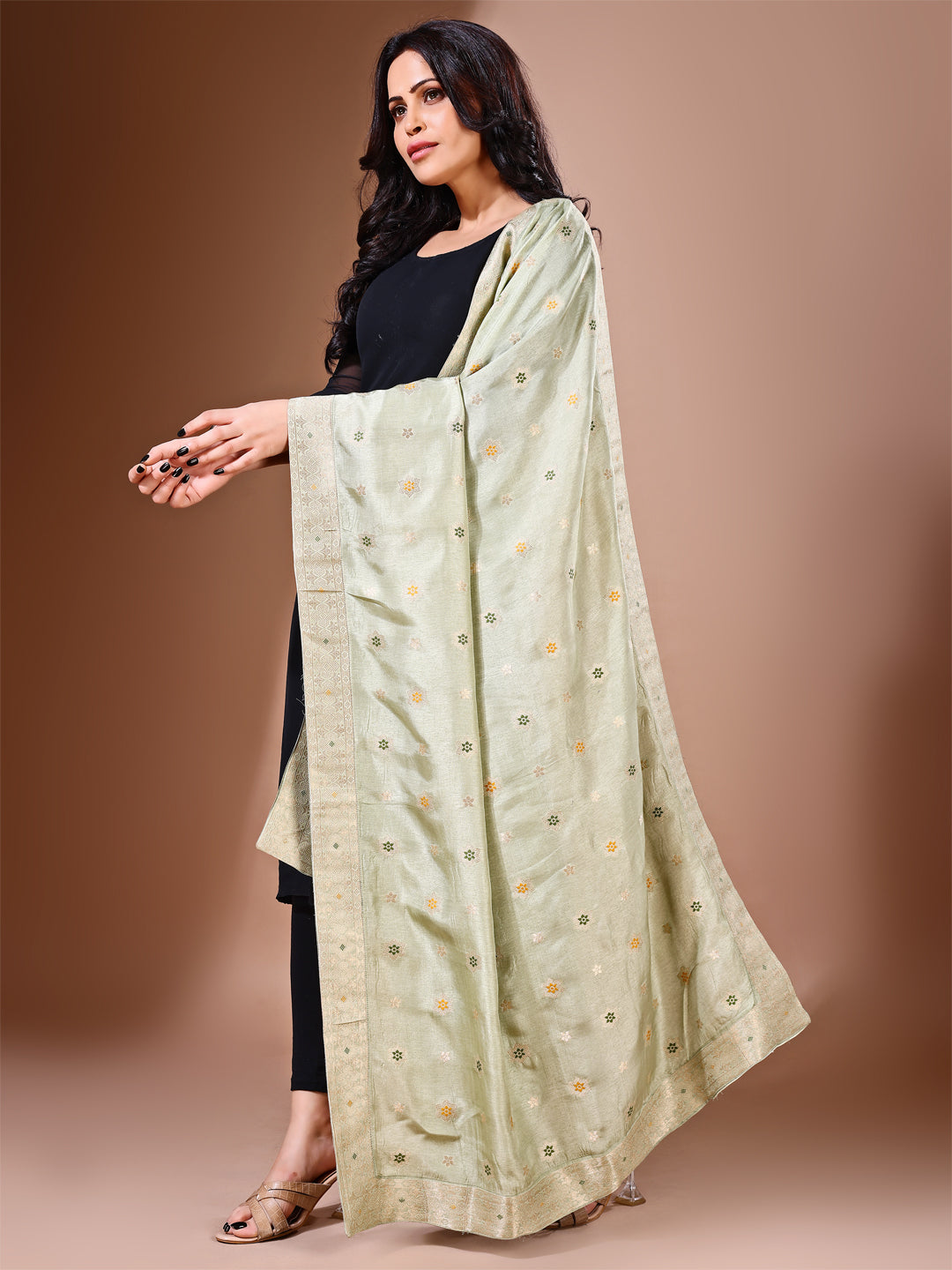 Side pose showcasing the green bridal dupatta, designed for weddings and special occasions.