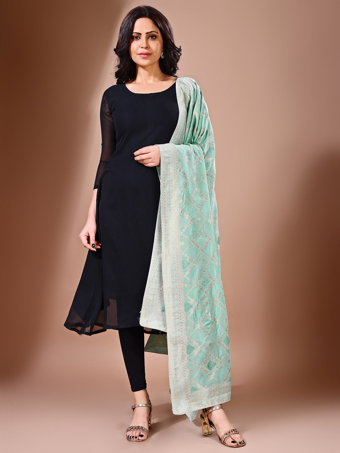 Side pose showcasing the green bridal dupatta, designed for weddings and special occasions.