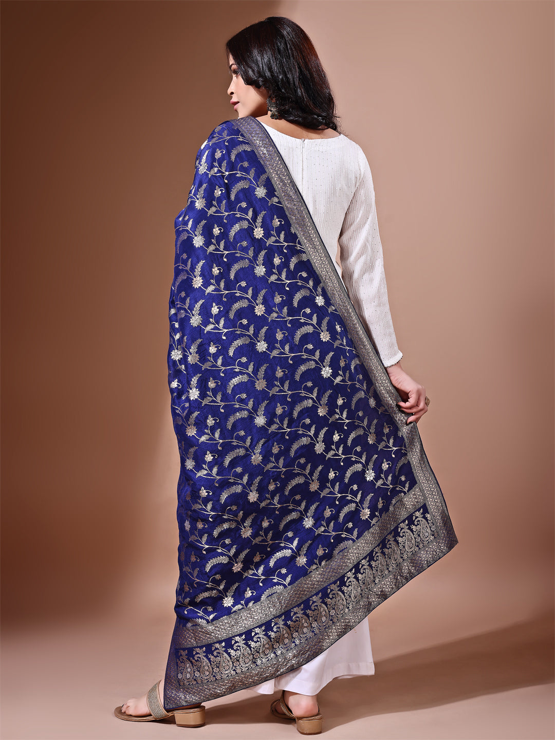 Model in a fancy pose wearing a navy blue Banarasi bridal dupatta, ideal for wedding wear.