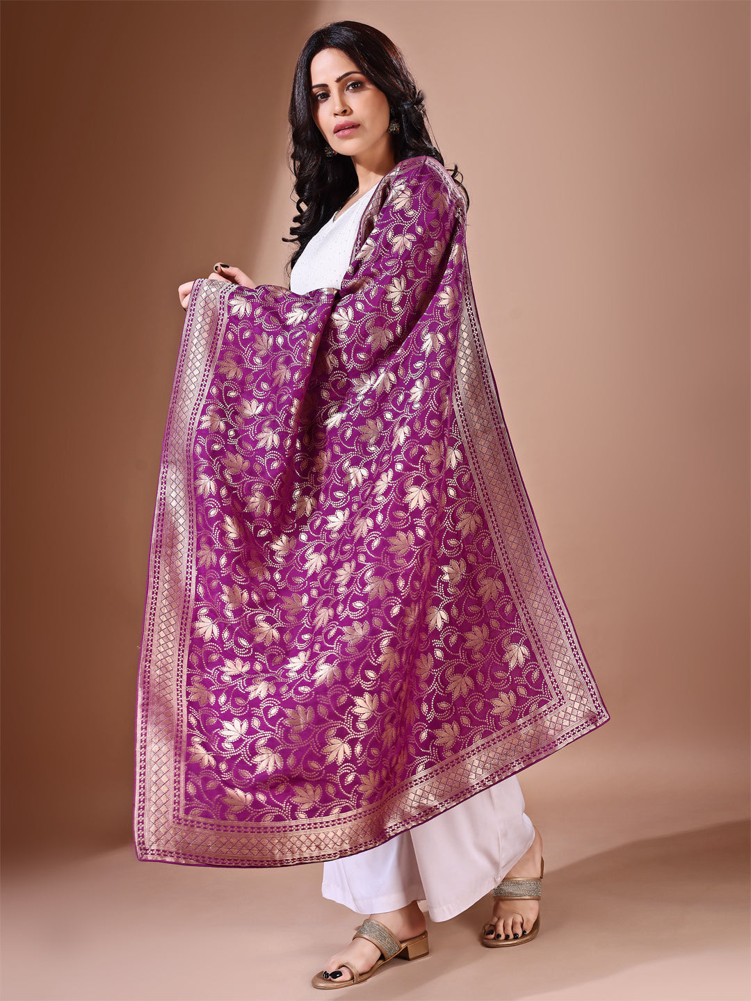 Close-up shot of purple Banarasi bridal dupatta with intricate zari work, perfect for weddings.