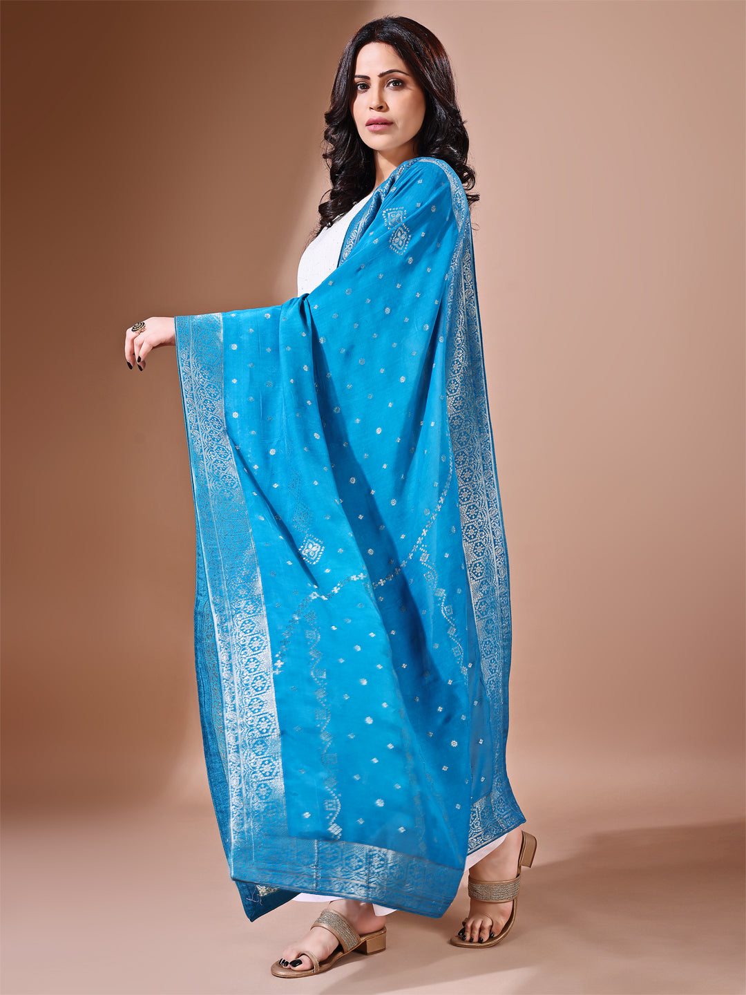 Close-up shot of rama blue Banarasi bridal dupatta with intricate zari work, perfect for weddings.