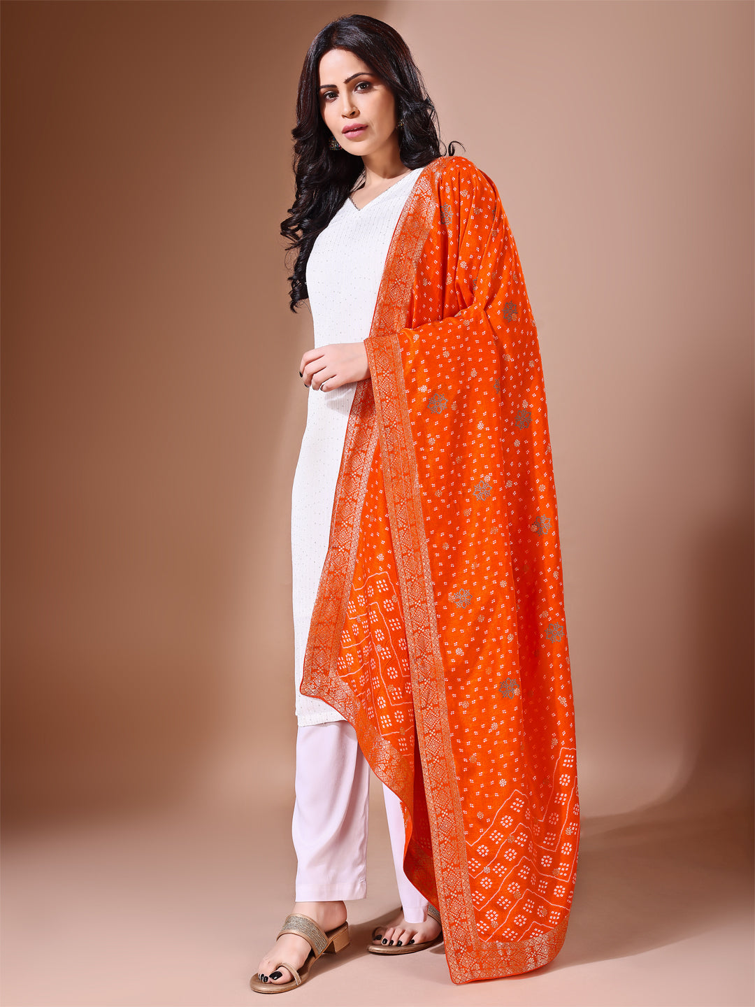 Side pose showcasing the rust bridal dupatta, designed for weddings and special occasions.