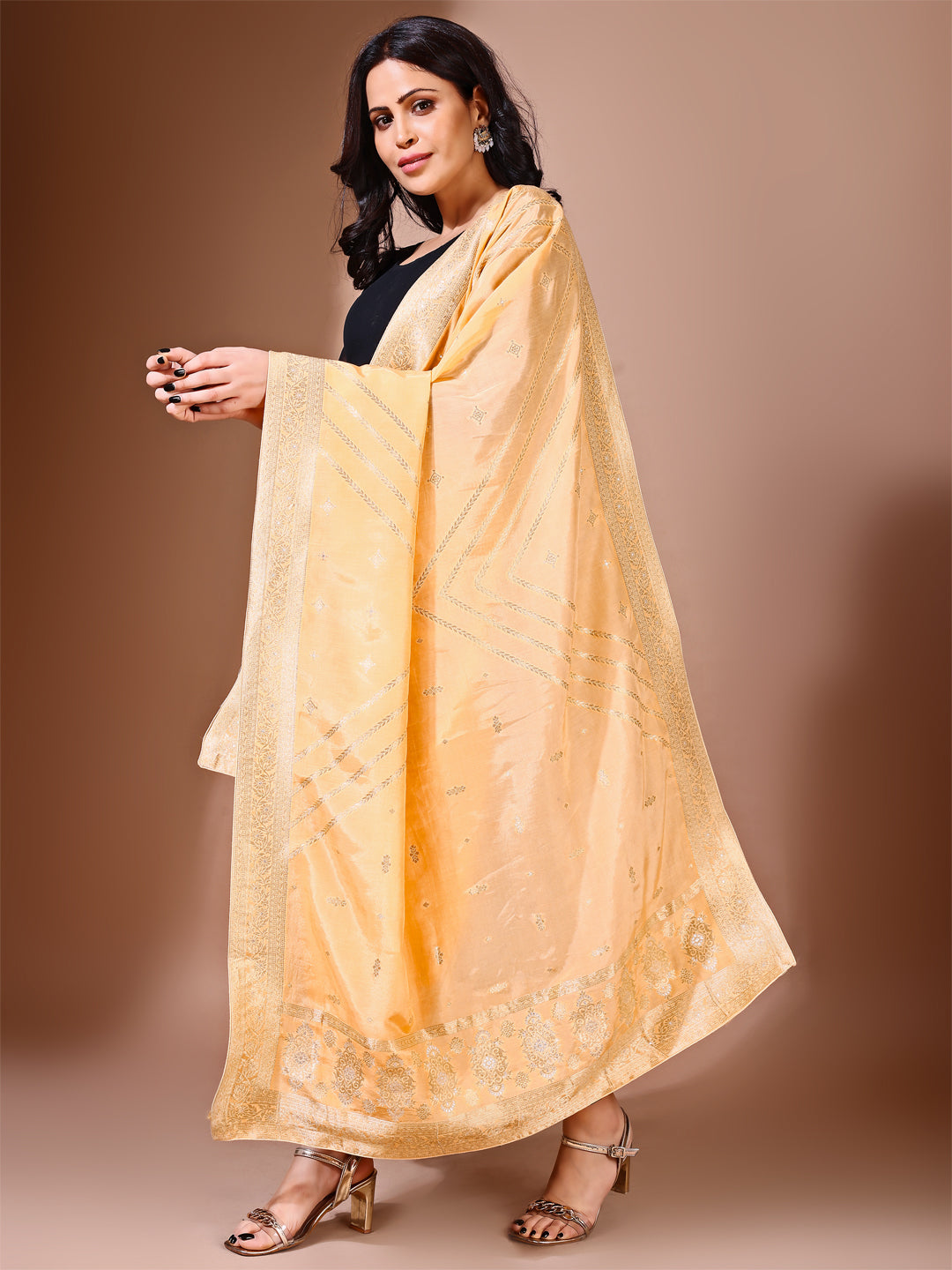 Side pose showcasing the yellow bridal dupatta, designed for weddings and special occasions.