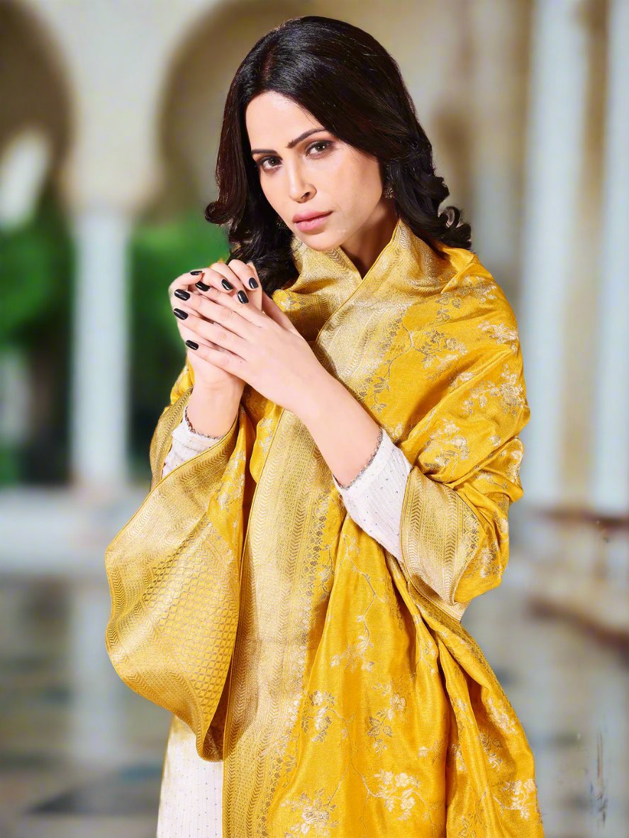 Back view of model wearing yellow bridal Banarasi dupatta, perfect for weddings.