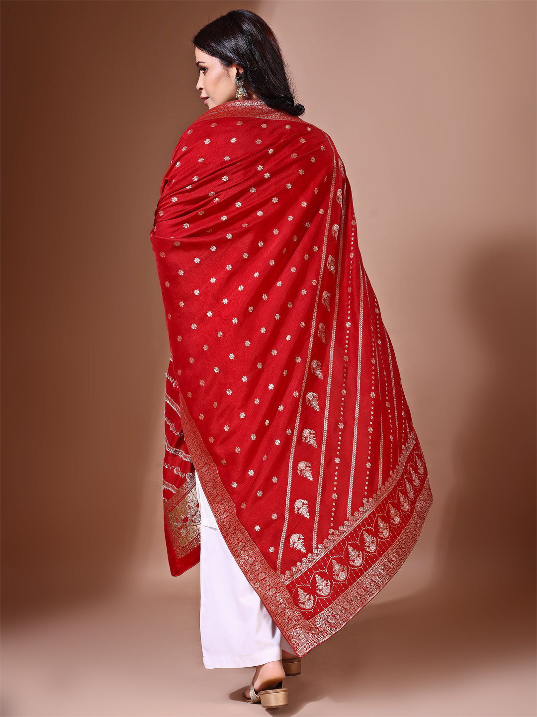 Model in a fancy pose wearing a cherry Banarasi bridal dupatta, ideal for wedding wear.