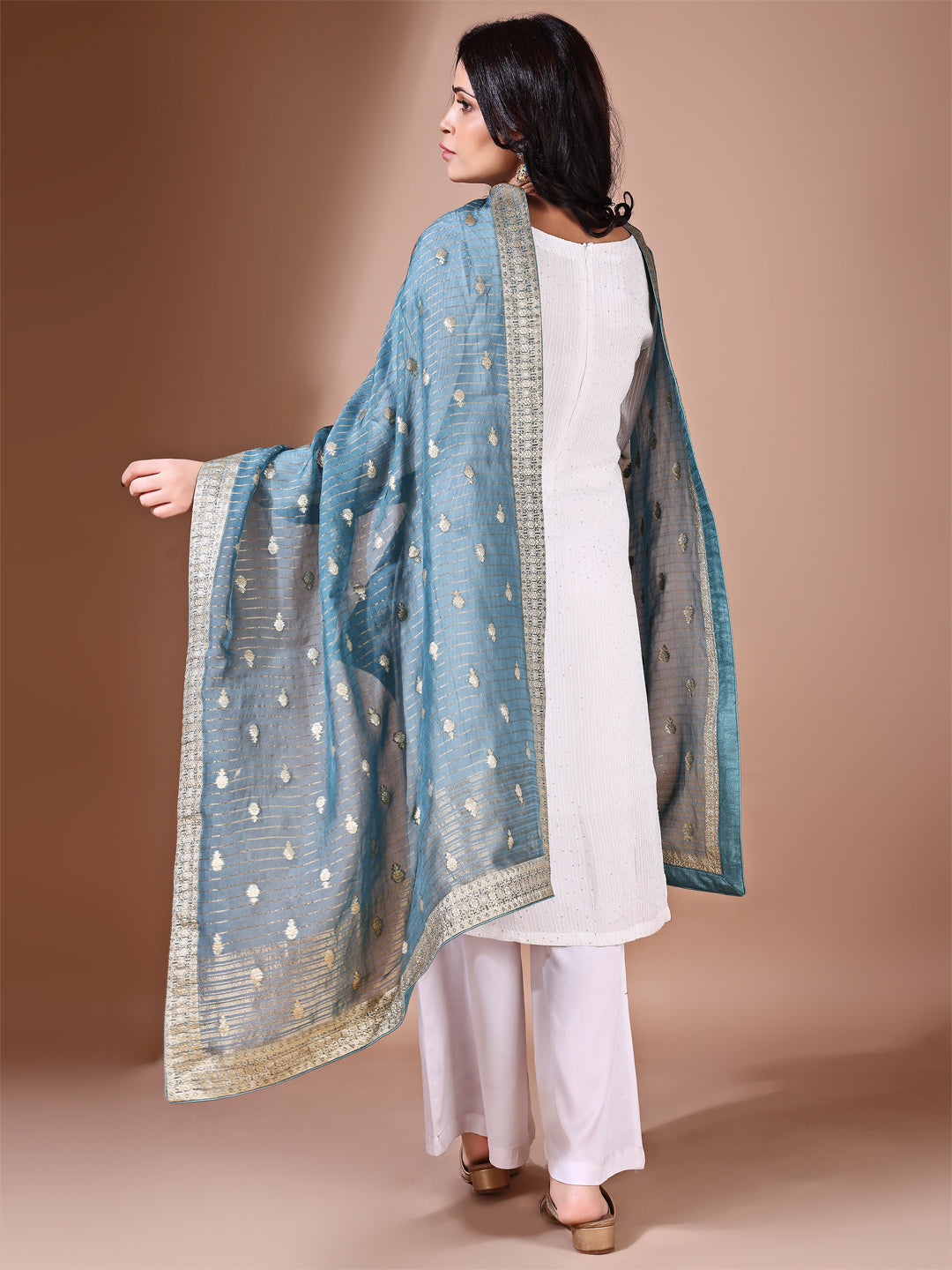 Model in a fancy pose wearing a cyan Banarasi bridal dupatta, ideal for wedding wear.