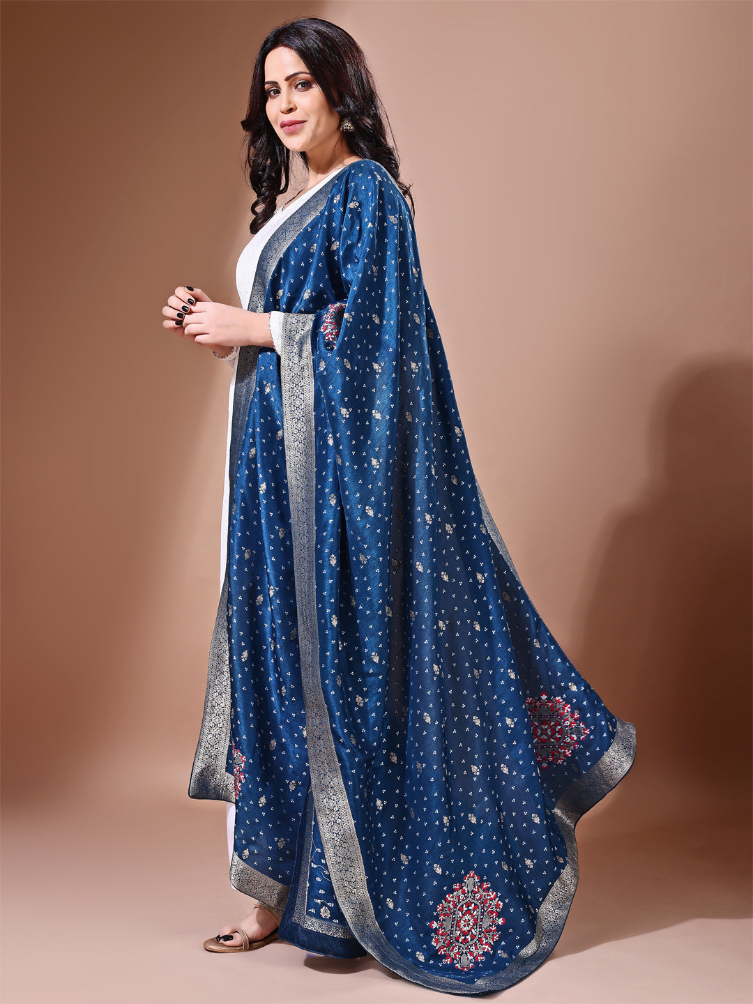 Close-up shot of blue Banarasi bridal dupatta with intricate zari work, perfect for weddings.