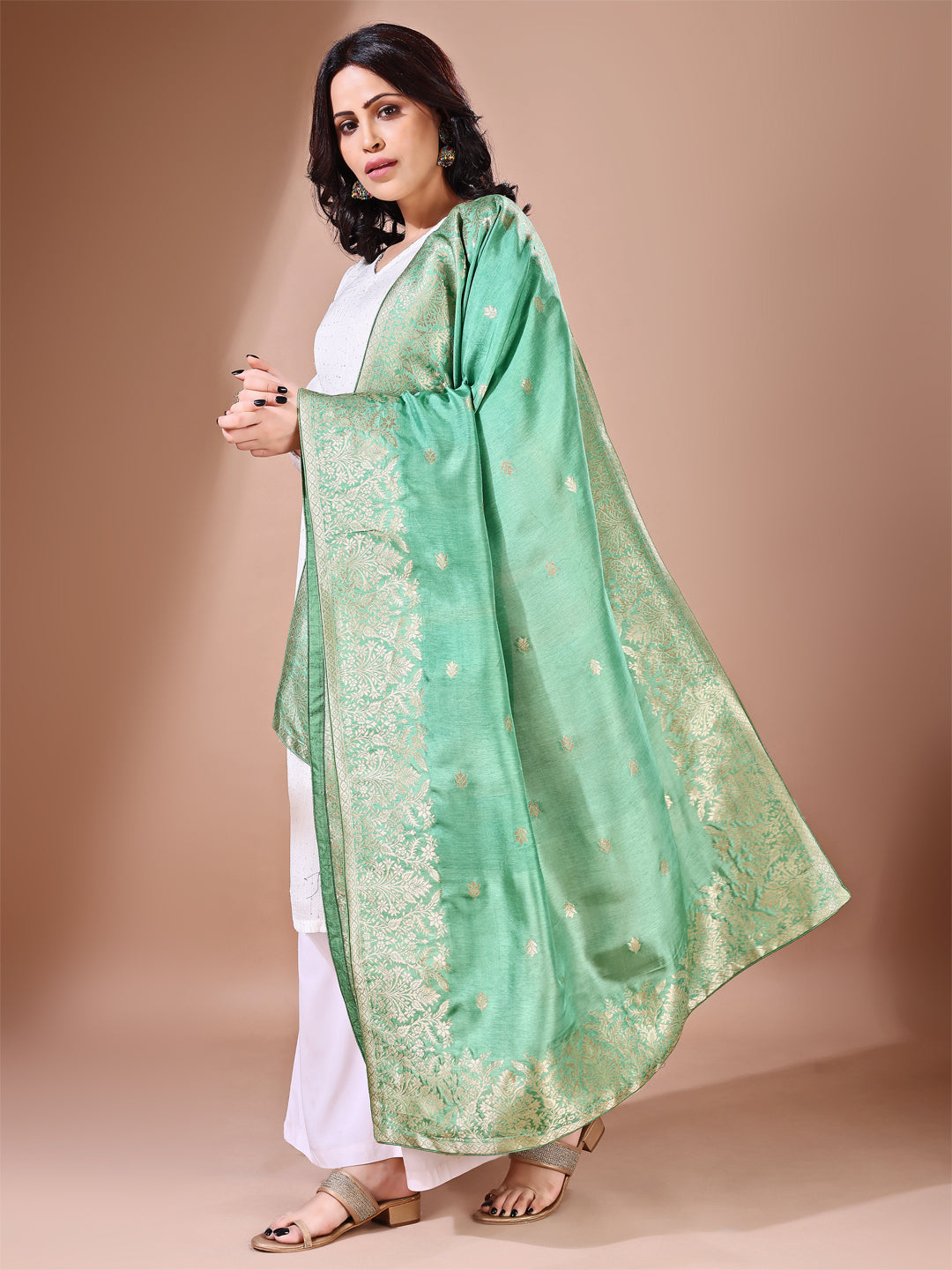 Side pose showcasing the green bridal dupatta, designed for weddings and special occasions.