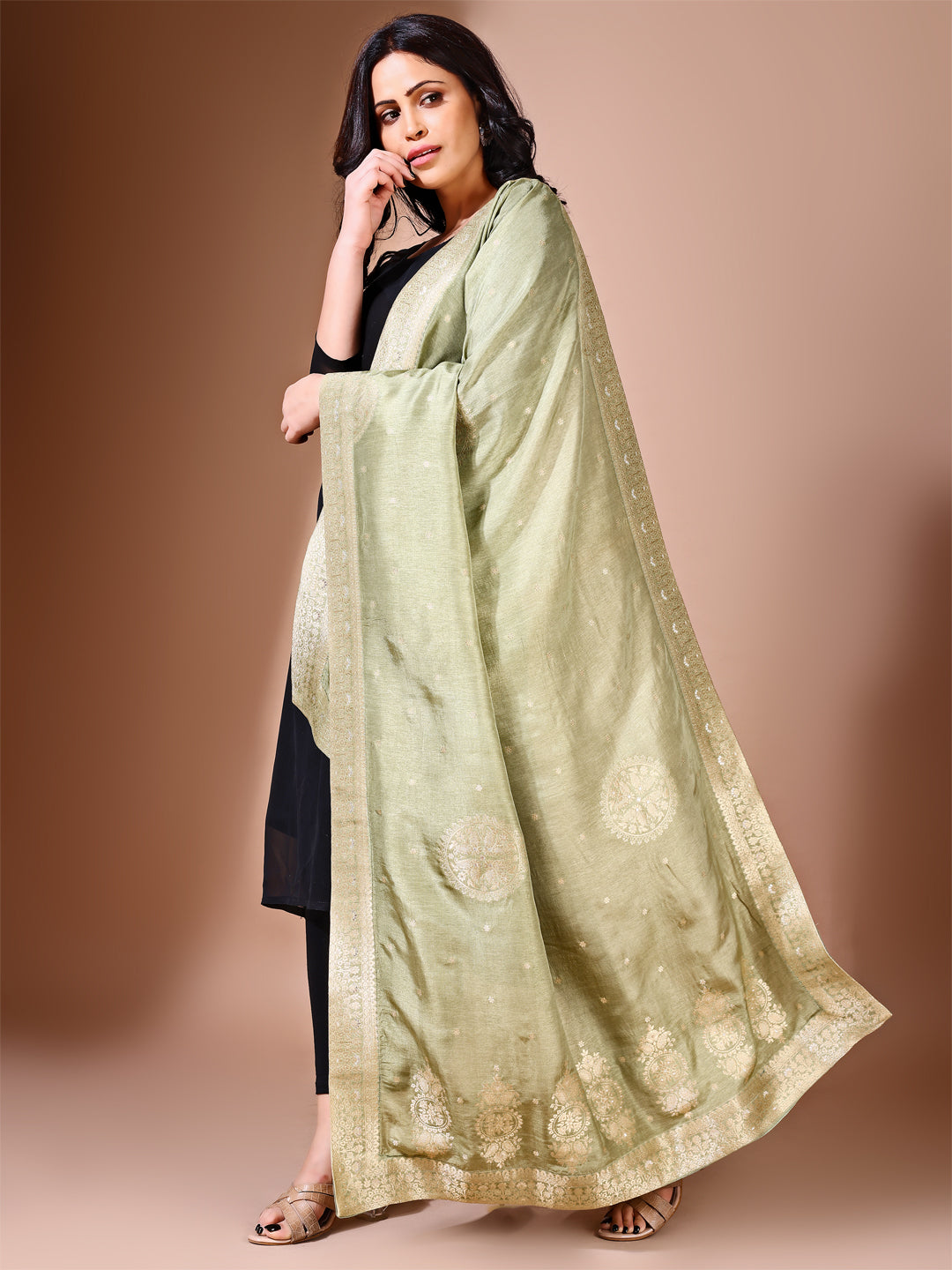 Side pose showcasing the green bridal dupatta, designed for weddings and special occasions.