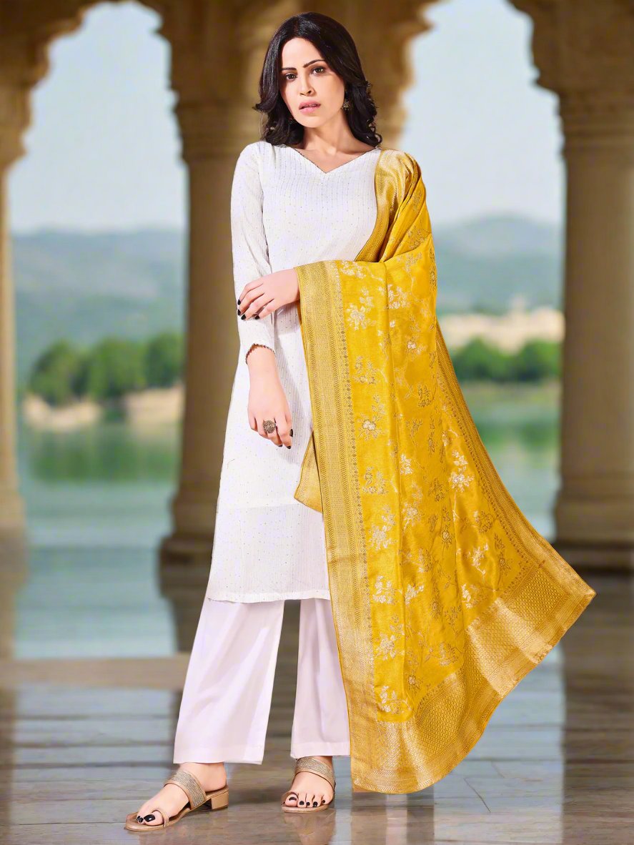 Model in a fancy pose wearing a yellow Banarasi bridal dupatta, ideal for wedding wear.