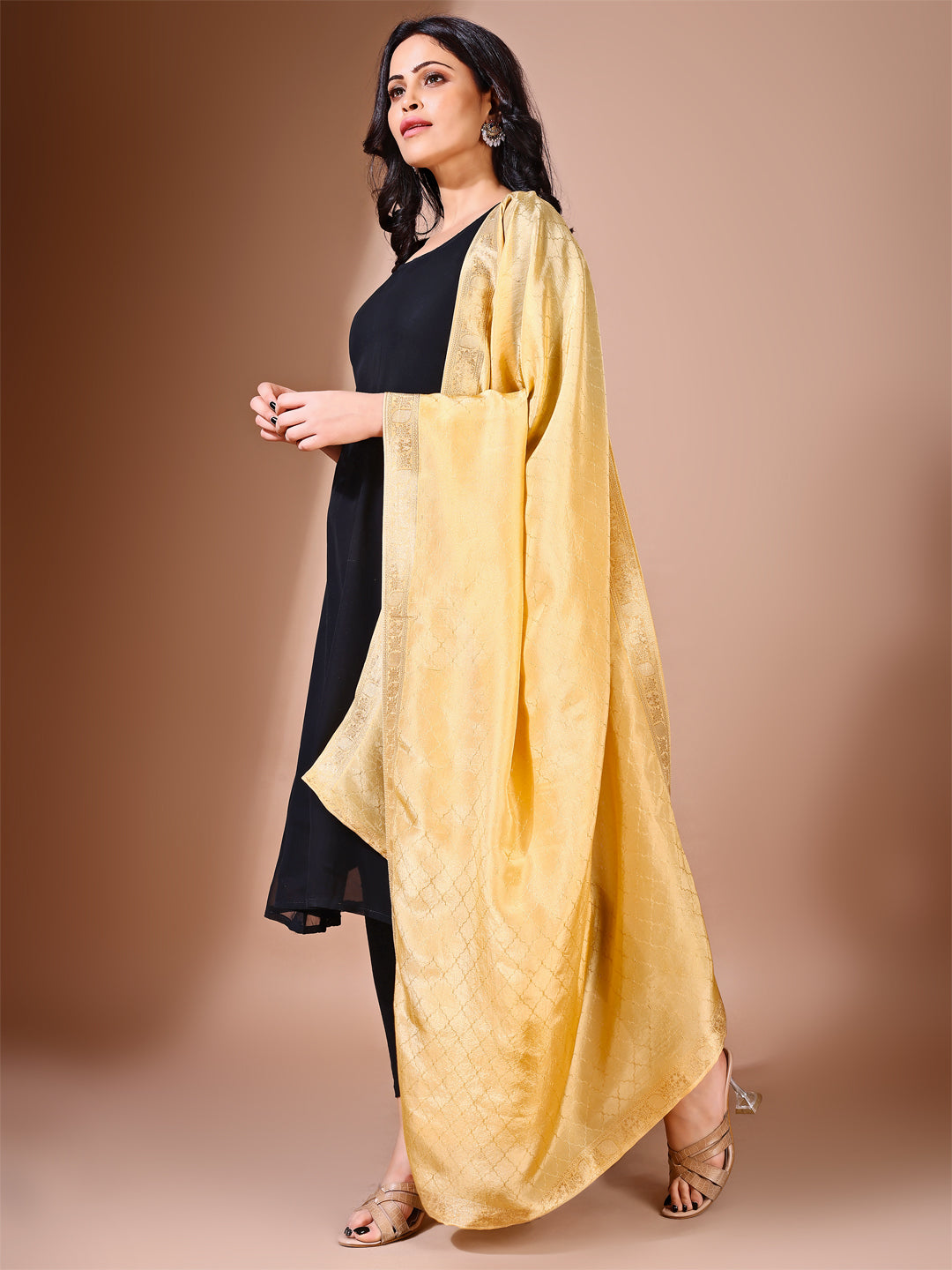 Close-up of golden essence dupatta, focusing on its subtle sophistication and bridal elegance for special occasions.