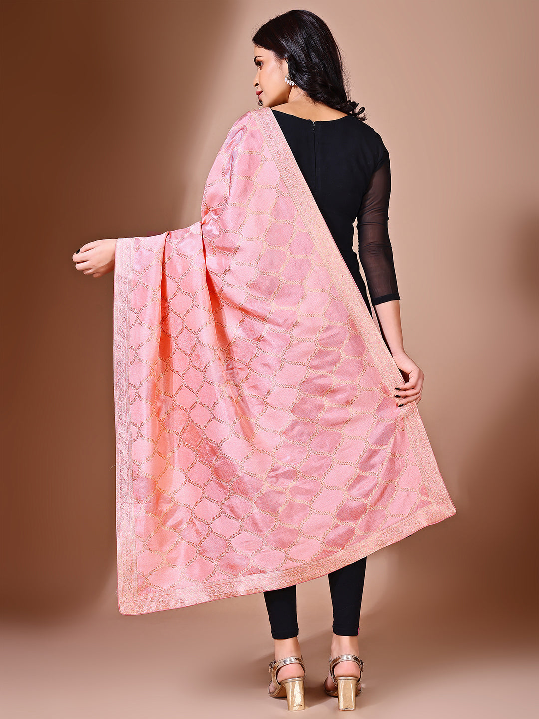 Model in a fancy pose wearing a gajari Banarasi bridal dupatta, ideal for wedding wear.