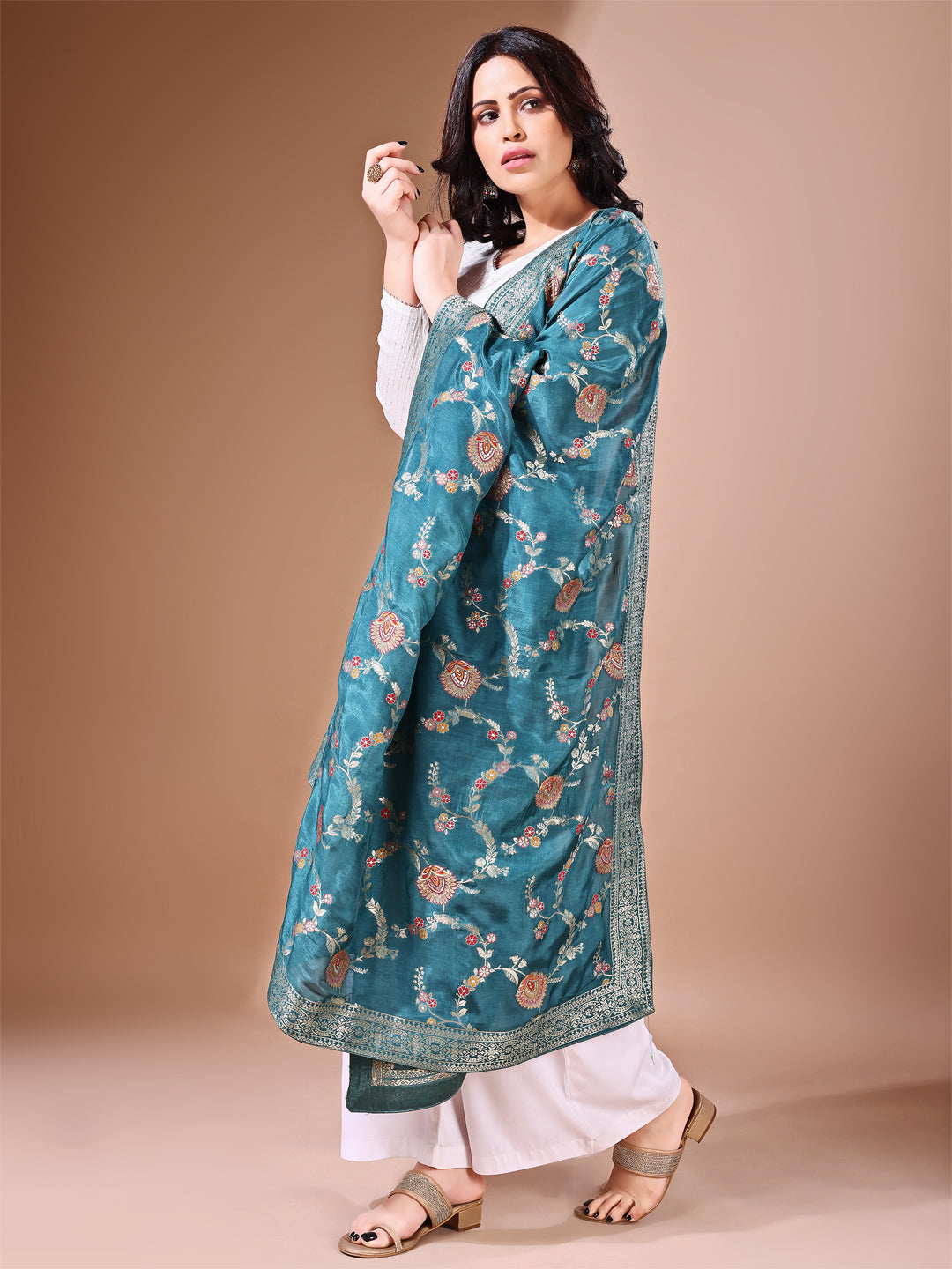 Side pose showcasing the green bridal dupatta, designed for weddings and special occasions.