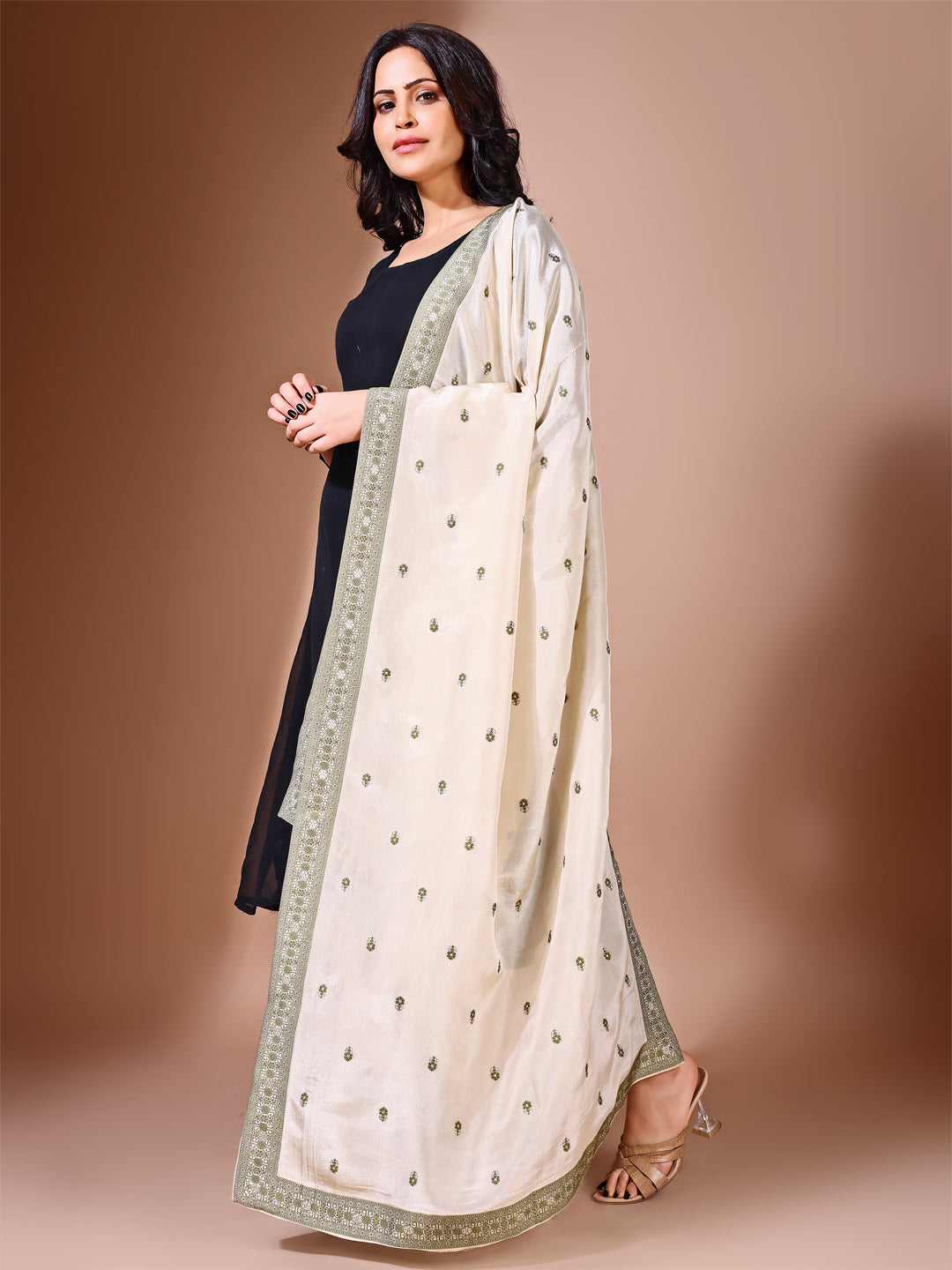 Side pose showcasing the green bridal dupatta, designed for weddings and special occasions.