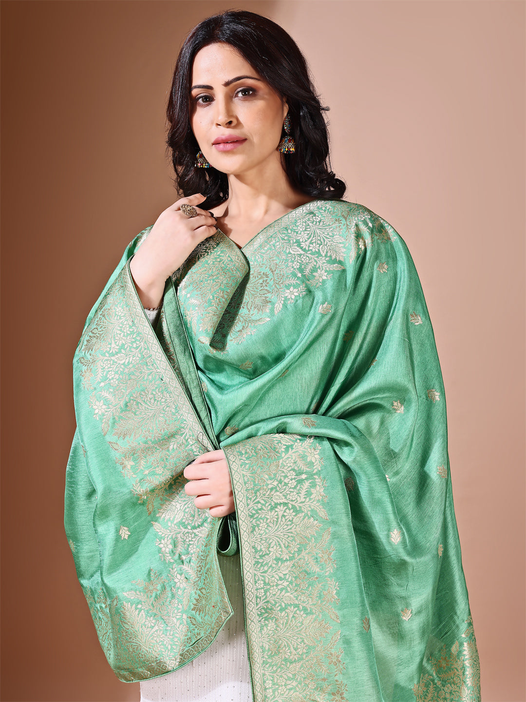 Back view of model wearing green bridal Banarasi dupatta, perfect for weddings.