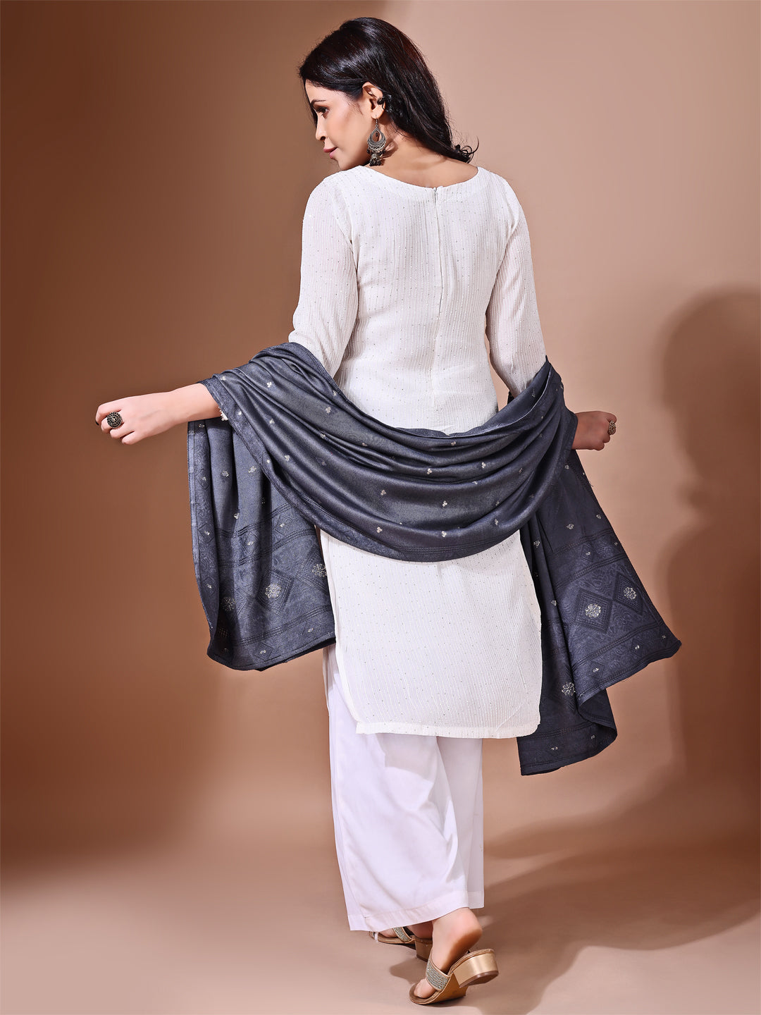 Model in a fancy pose wearing a grey Banarasi bridal dupatta, ideal for wedding wear.