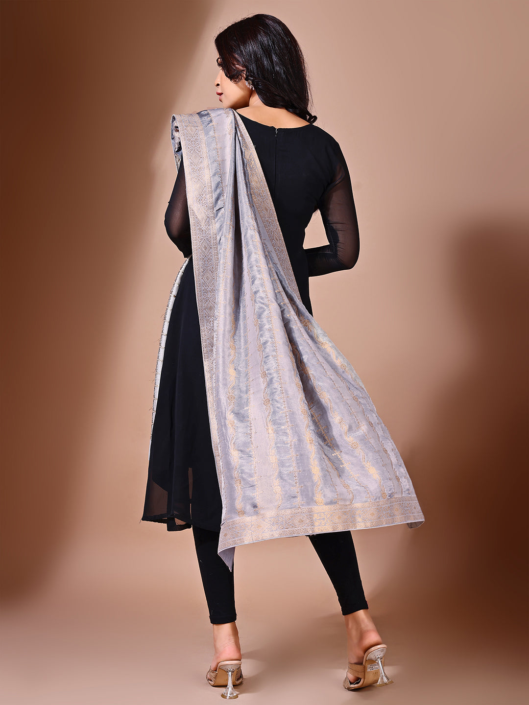 Model in a fancy pose wearing a grey Banarasi bridal dupatta, ideal for wedding wear.