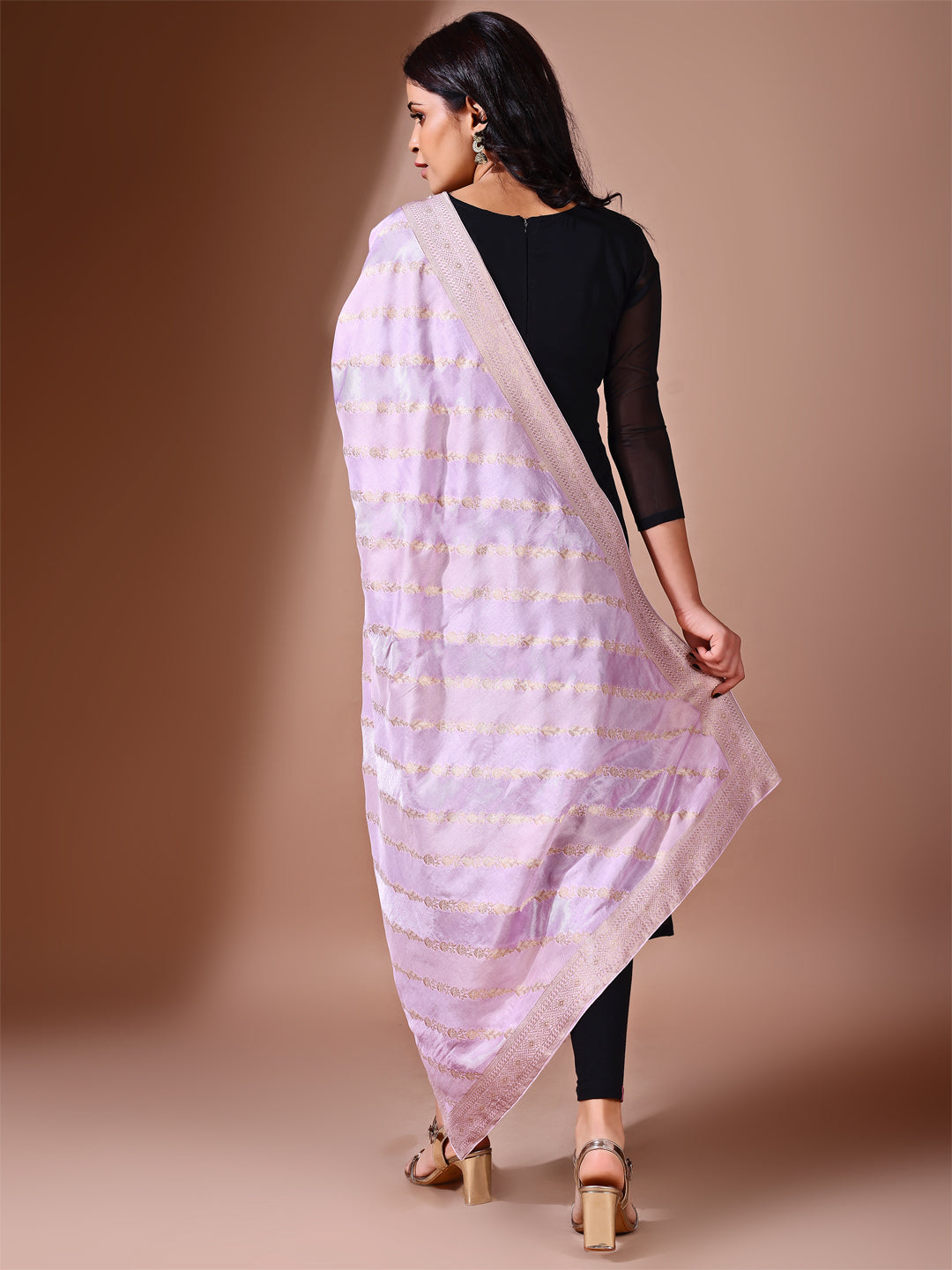 Model in a fancy pose wearing a lavender Banarasi bridal dupatta, ideal for wedding wear.