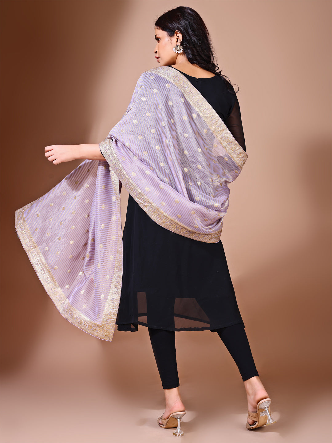 Model in a fancy pose wearing a lavender Banarasi bridal dupatta, ideal for wedding wear.