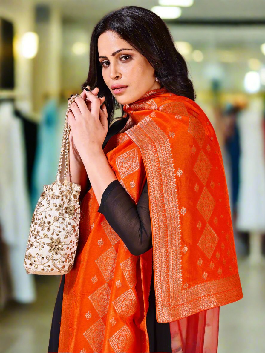 Back view of model wearing orange bridal Banarasi dupatta, perfect for weddings.