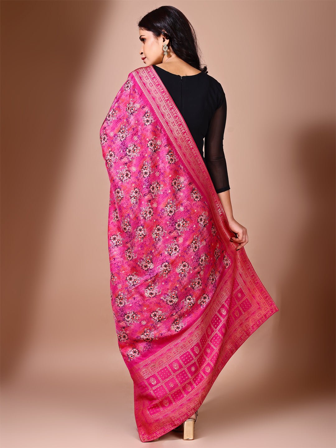 Model in a fancy pose wearing a pink Banarasi bridal dupatta, ideal for wedding wear.