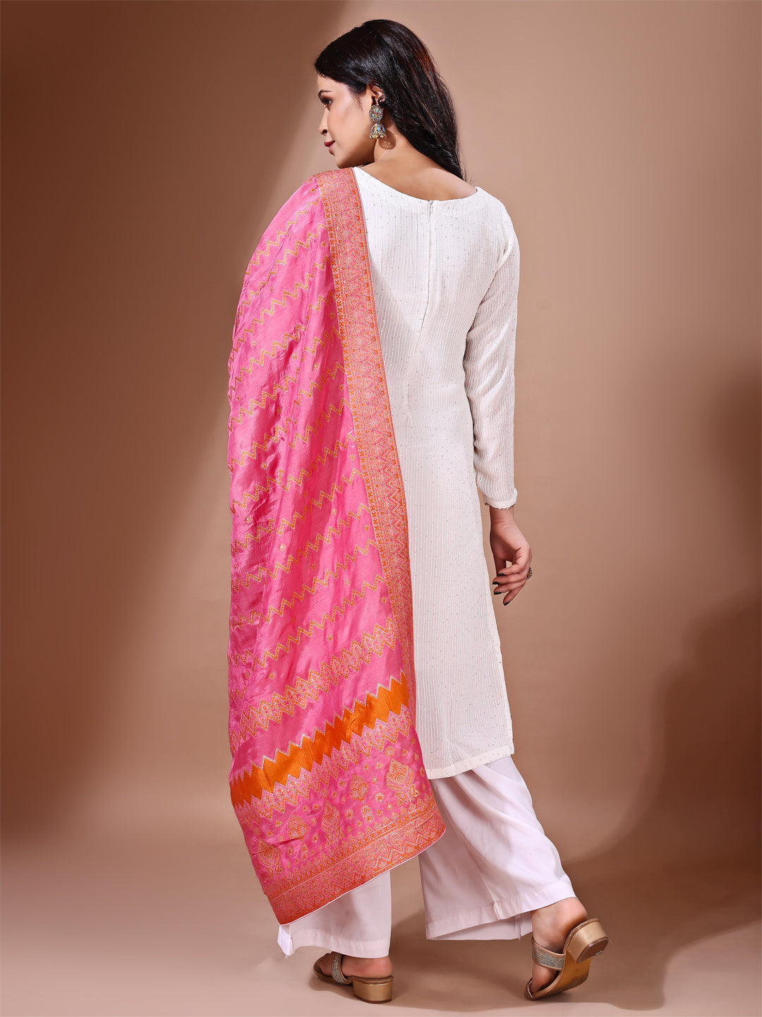 Model in a fancy pose wearing a pink Banarasi bridal dupatta, ideal for wedding wear.