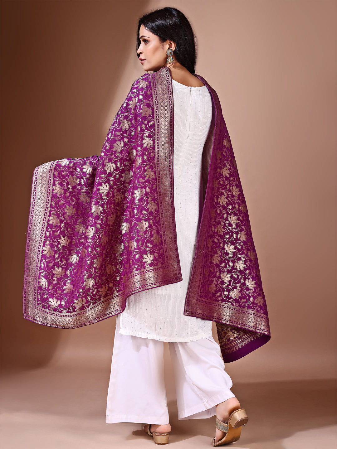 Model in a fancy pose wearing a purple Banarasi bridal dupatta, ideal for wedding wear.