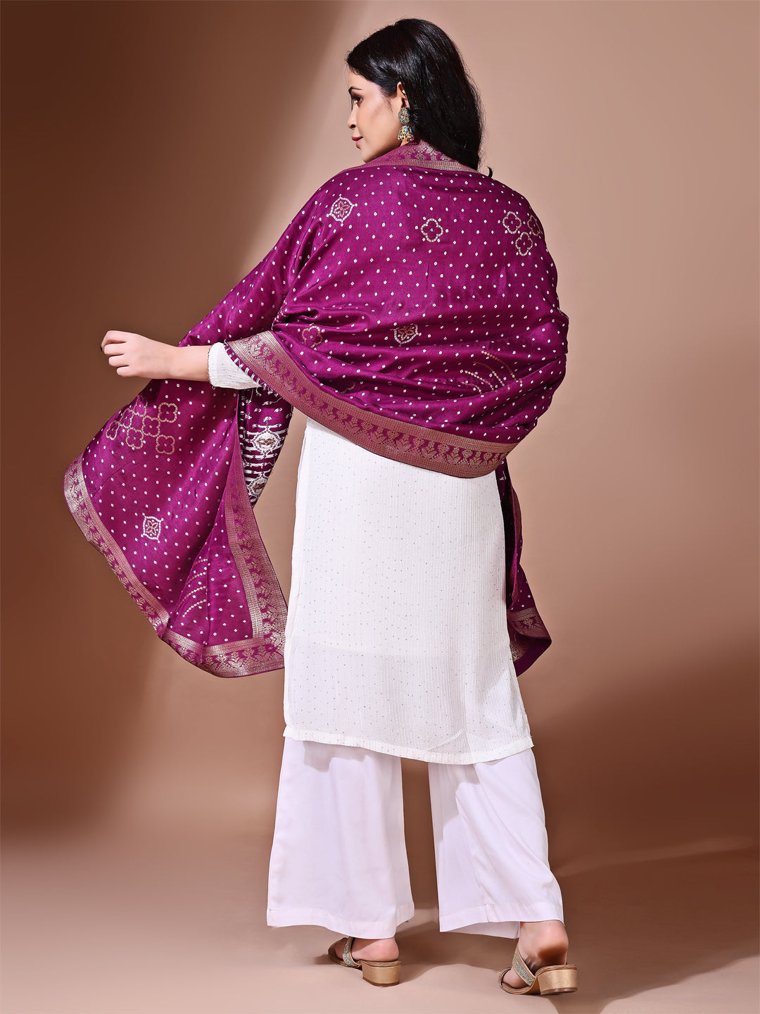 Model in a fancy pose wearing a purple Banarasi bridal dupatta, ideal for wedding wear.