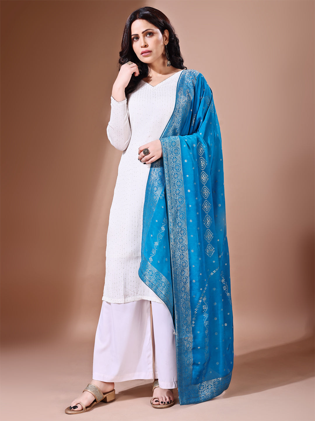 Side pose showcasing the rama blue bridal dupatta, designed for weddings and special occasions.