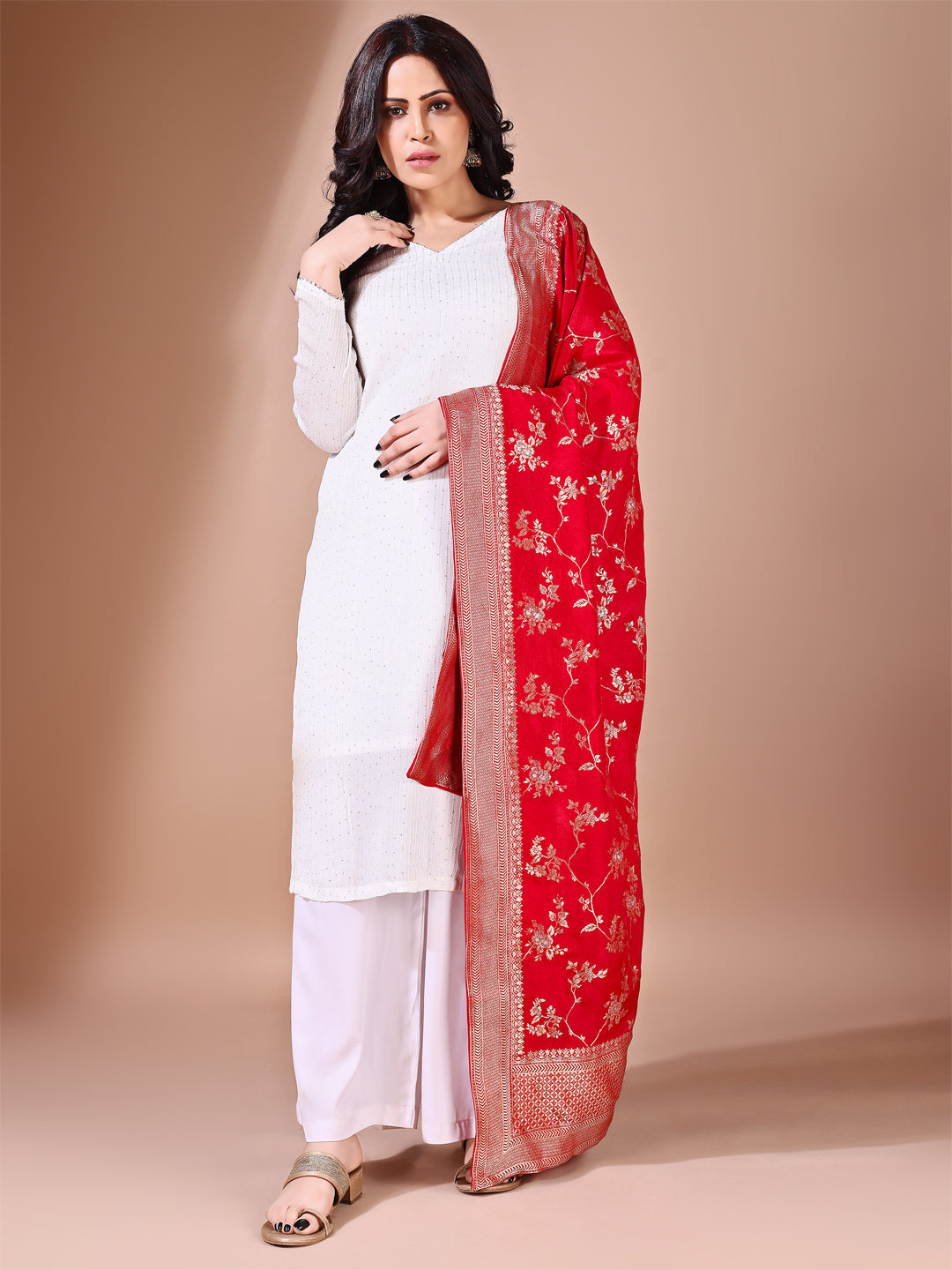 Side pose showcasing the red bridal dupatta, designed for weddings and special occasions.