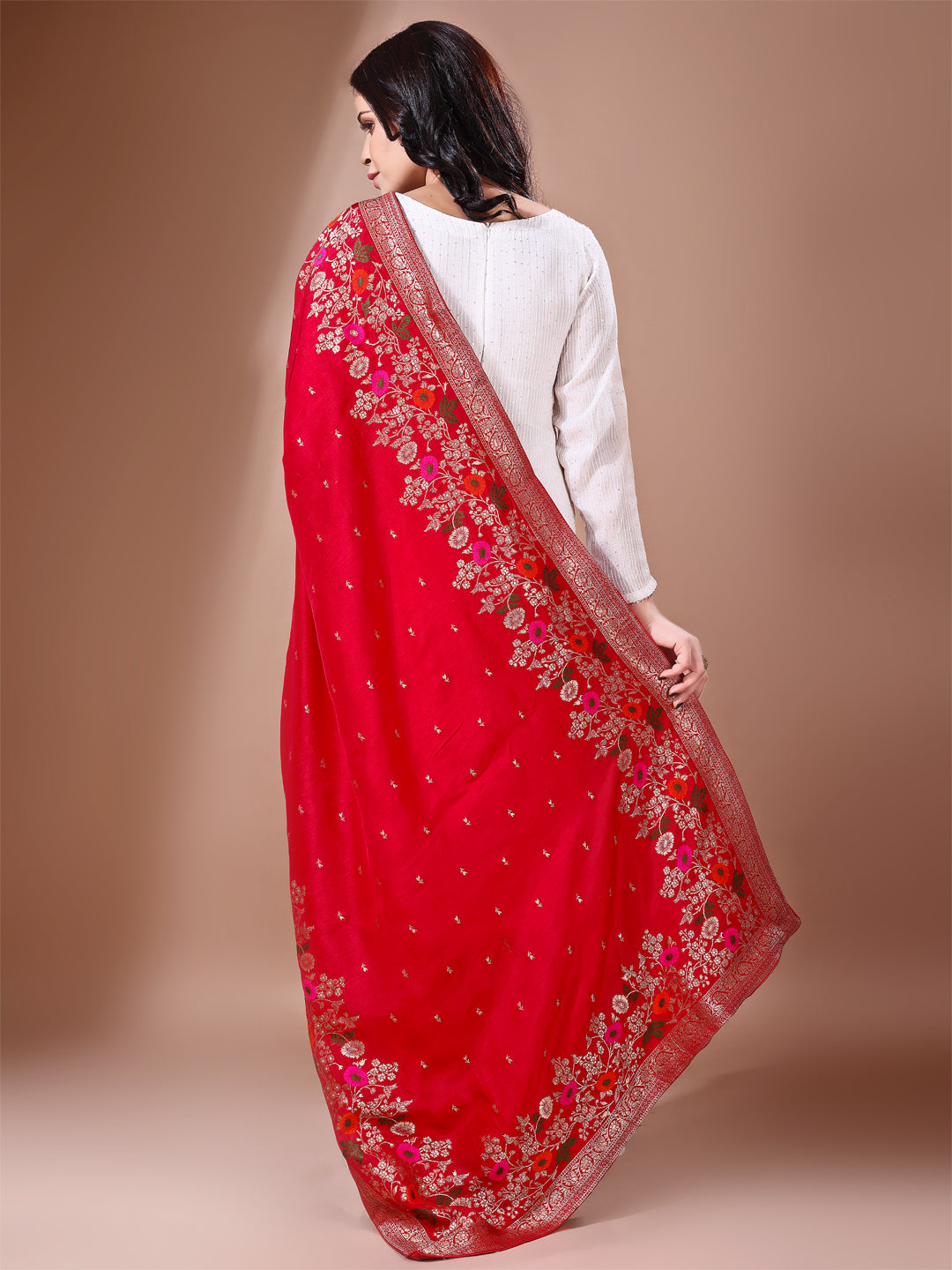 Model in a fancy pose wearing a red Banarasi bridal dupatta, ideal for wedding wear.