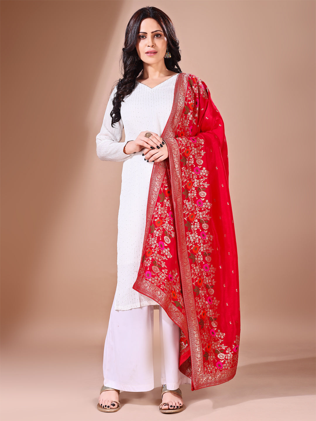 Side pose showcasing the red bridal dupatta, designed for weddings and special occasions.