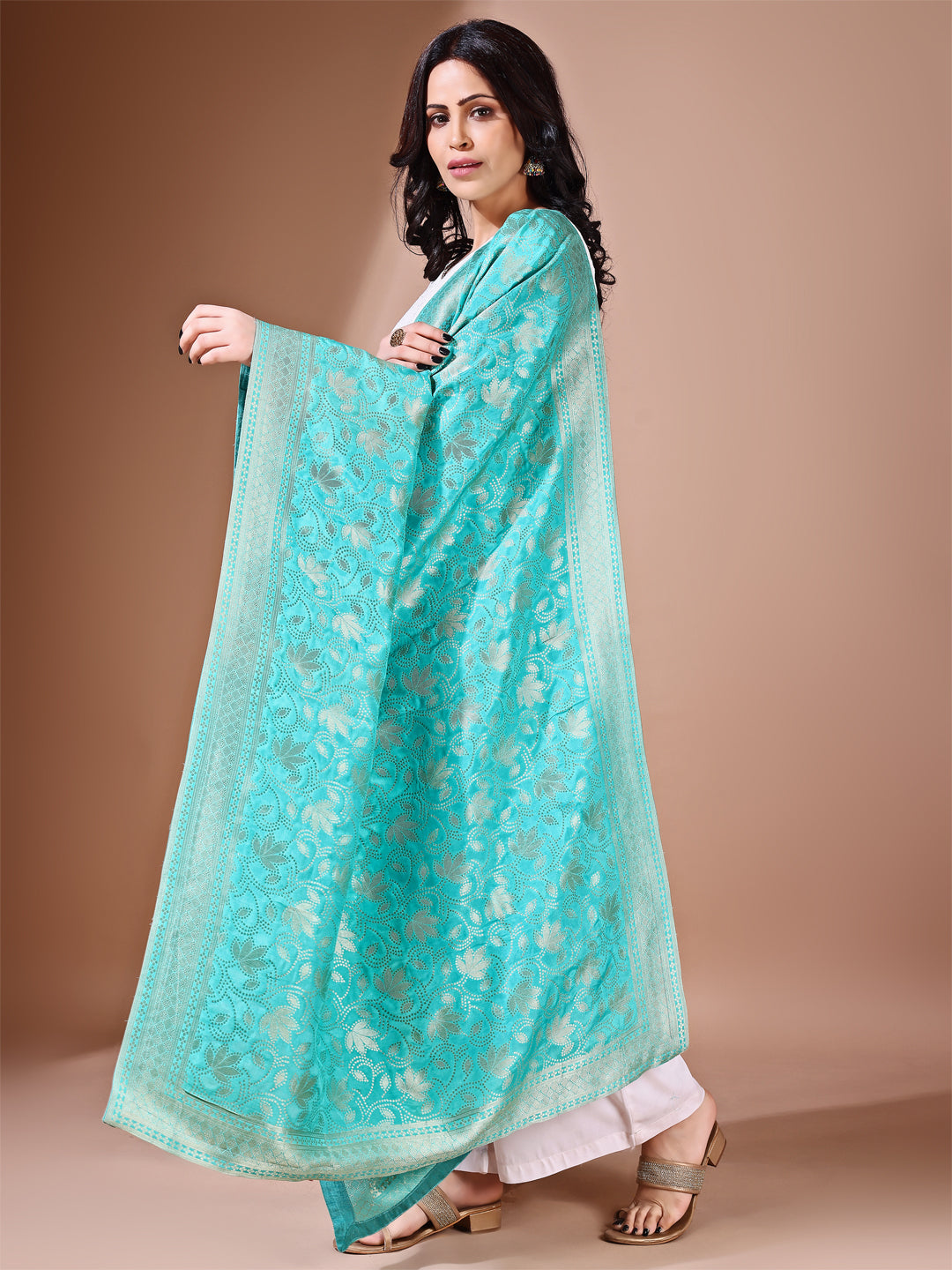 Close-up shot of sea green Banarasi silk dupatta with zari work, emphasizing bridal elegance and detailed craftsmanship.