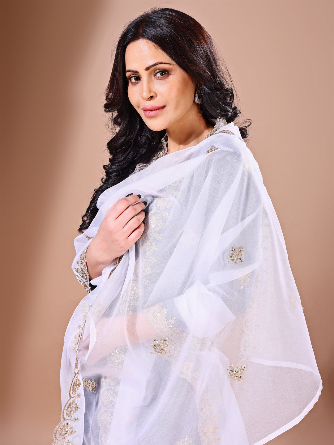 Back view of model in a white floral embroidered dupatta, showcasing elegance for wedding occasions.