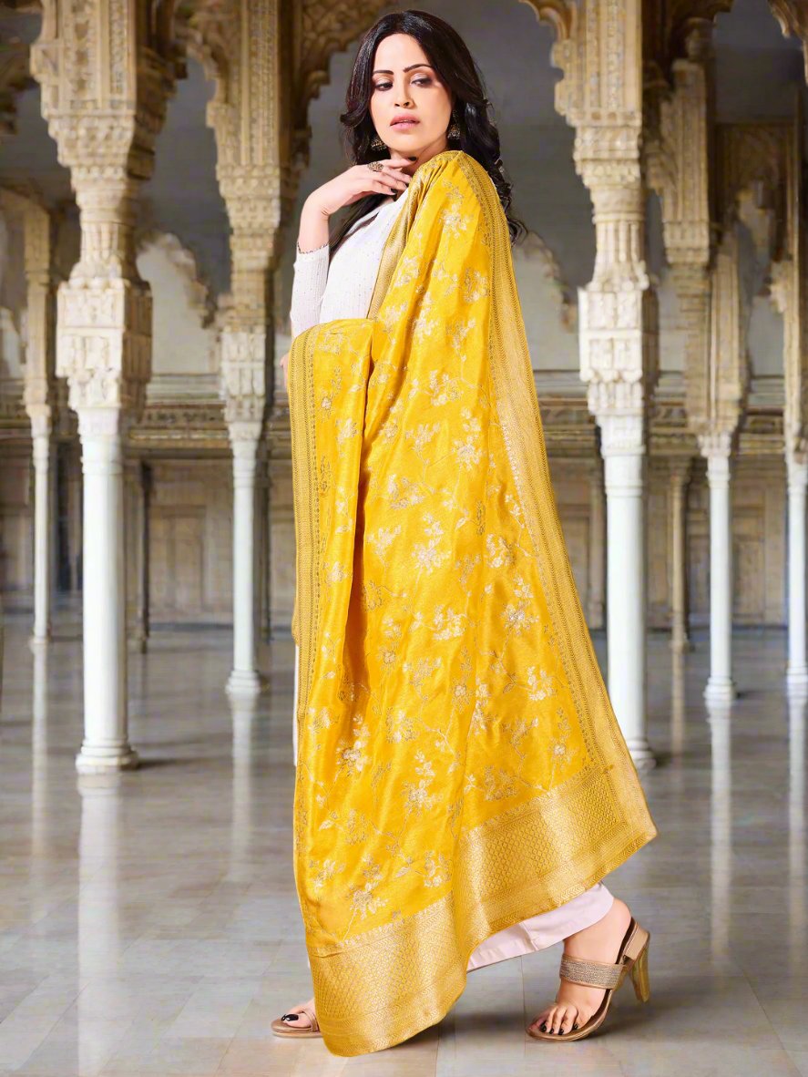 Side pose showcasing the yellow bridal dupatta, designed for weddings and special occasions.