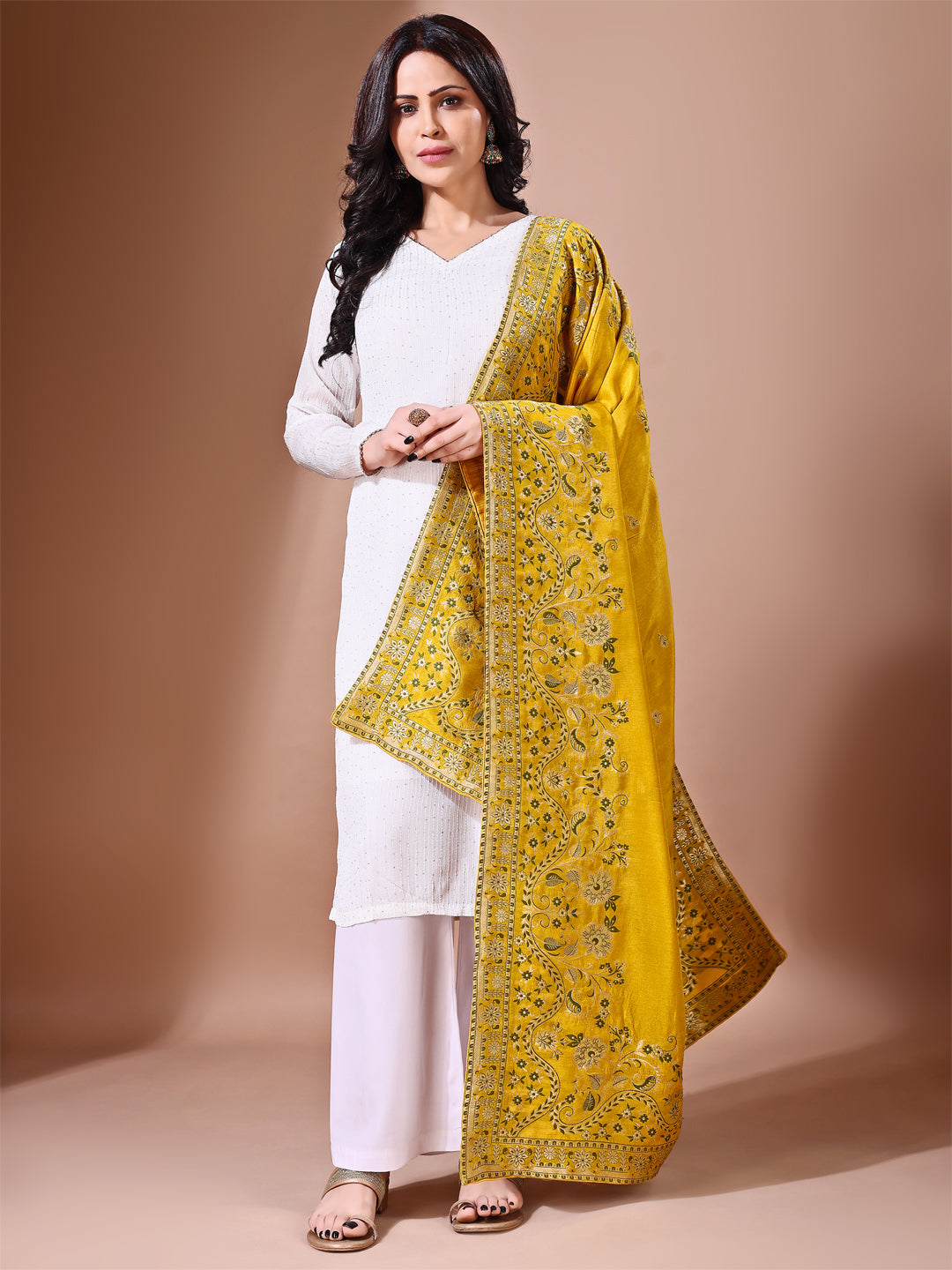 Side pose showcasing the yellow bridal dupatta, designed for weddings and special occasions.